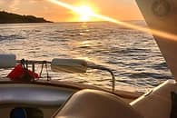 Tour di gruppo in barca al tramonto