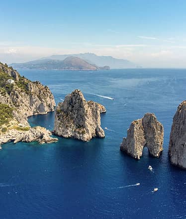 Transfer by boat to Capri beach clubs